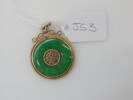 Circular jade and gold pendant