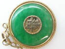 Circular jade and gold pendant