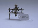 Figure, silver, on bench, knitting