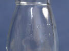 milk or cream bottle - detail, close  up [1999.169.7]