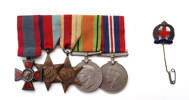 medal set and badge previously on display together red cross