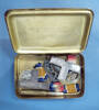 badges and medals inside Princess Mary gift tin of Pte WS Thompson, 1NZEF, WW1 [2007.13.1-.9]