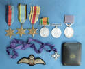 medals and badge of Sgt. OW Thompson, RNZAF, WW2 [2007.13.10-.17]