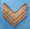chevron rank badge, of Gunner EA (Ted) Frost, WW2 [2007.78.26] - front view