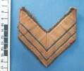 chevron rank badge, of Gunner EA (Ted) Frost, WW2 [2007.78.26] - ruler view