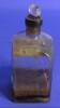 Clear glass bottle with glass stopper, brown liquid/solids, part of medicine chest [col.0013]