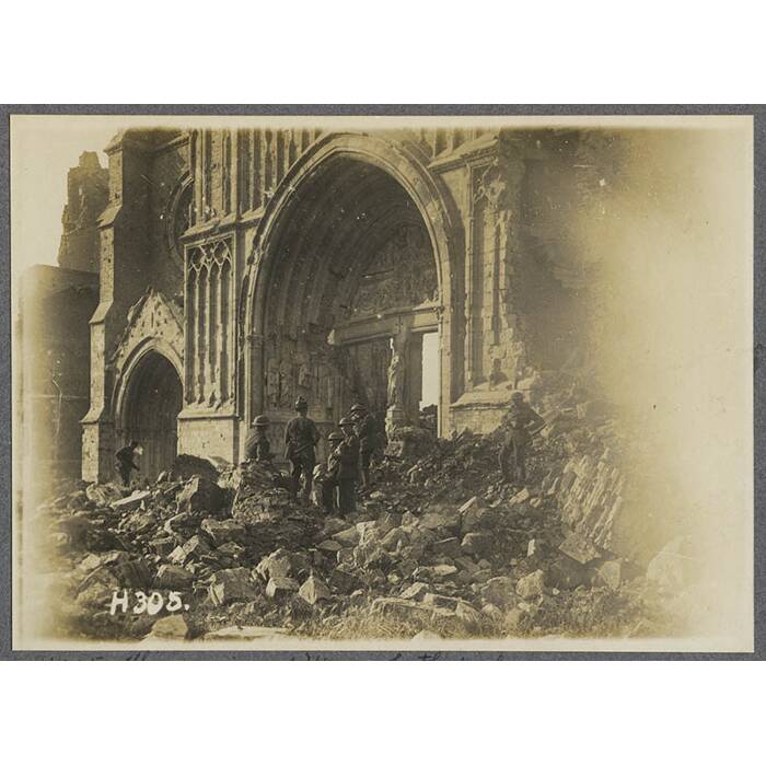 The ruins of Ypres Cathedral. N.Z. troops looking for souveniers.