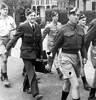 LAC Mervyn Davis RNZAF (holding suitcase) pictured on the march at the RNZAF Initial Training Wing (ITW) in Rotorua, 1943. Davis attended the ITW between May and December 1943.Davis jokingly wrote on the obverse of the photograph "Doctor Davis," referencing his carrying of a suitcase.