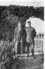 Martha and George Smith standing in a garden, George wearing his military uniform.