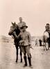 1940 16th June taken at the pyramids Peter Harrison a tent mate is holding the horse. John Moir on horseback.