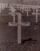 A white cross marking the grave of 41283 John Thomas (Jack) Harvey. Plot 10, Row 10, Grave 19.