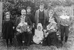 Left to Right: Cath, JIM on his father&#39;s knee (James)Win (later Sister Serenus) , Paddy with baby Una in front Dan on Sarah&#39;s knee and Leo on right