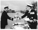 Acting Sub-Lieutenant Peter Thompson RNZN reaching the Williams Shield from Commander-in-Chief Plymouth, Vice Admiral Sir Charles Madden RN, formerly Chief of the New Zealand Naval Staff, Portsmouth, February 1963.