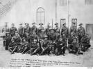 Caption reads :Identified back row, left to right are: Warrant Officer Finlay; Sergeant (Sgt) Archibald; Corporal (Cpl) Hibbs; Trooper (Tpr) Dwyer; Tpr Davies; Cpl Manly; Tpr Byrne; Sgt Jansen (probably 370 William Jansen); Cpl Whyburn (probably 749 Leslie Richard Whyburn); Sgt Waugh; Tpr [illeg possibly Bonney]. Middle row: 1163 Tpr Jesse Garrood; Cpl Murray; Tpr Clarke; Captain (Capt) Thomas Leslie Willsallen (later DSO); Capt Bice; Lieutenant (Lt) Easterbrook; Cpl Rose; Sgt Lowe; Cpl James. Front row: 140 Sgt Carl Anton Teschner; Tpr Kenning; Cpl Hill; Sgt Horn; Cpl Foley; Cpl Flood. Cpl Rhodes and Tpr Anderson were absent in hospital when this photograph was taken. This photograph is the original from which A04862 was copied.