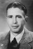 William Victor Graham wearing a tweed jacket white shirt and a man's tie, on his lapel is an RSA badge 