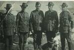 Six members of "D" Company, 9th W(EC) Regiment at the Oringi (HB) Territorial Camp, 1913. From left, Sgt H. O. Hansen, Sgt R. F. Gambrill, CSM F. W. Selves, Sgt T. A. Hunter, Sgt A. Duncan. In front, Bugler F. R. Porter.