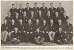 RUGBY ALL BLACKS FOR 1938-THE OFFICIAL GROUP. From left, back row: A. W. Wesney, J. A. Hooper, A. Lambourn, W. J. Phillips, W. N. Carson, E. Jackson, J. L. Sullivan. Second row: L. George, A. A. Parkhill, C. W. Williams, R. R. King, J. Wynyard, A. W. Bowman, H. Milliken, T. Morrison, Front row: J. M. Taylor, D. Dalton, R. McKenzie (vice-captain), Dr. G. L. Adams (manager), N. A. Mitchell (captain), Mr. A. McDonald (manager), E. Tindill, C. E. Quaid, J. L. Griffiths. In front: T. Berghan, C. K. Saxton, A. H. Wright.