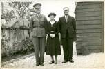 William (Bill) Camille Butland in army uniform, with his parents Marguerite Marie (Daisy) Butland and Harry Butland on his last day in Hokitika before he left for active service in Europe and North Africa. Taken December 1939, Hokitika.