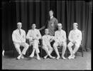 21 Dec 1915 - George Vincent Gerard, captain (second on left); coach, Hartley Travers Ferrar; cox Frank Griffith Bristed (seated centre). Other boys are Douglas Richmond Stanley, Walter Ronald Cox, and Selwyn Henry Meyrick Hawkins, Photograph taken by the Steffano Webb Photographic Studio, Christchurch.