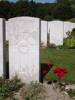 Headstone of William Joseph Page at Etaples Military Cemetery, France.  Photograph taken by William Page&#39;s great-niece in August 2005.  Site has been visited by several family members (yellow at base of headstone is the Waihi RSA card of Page&#39;s nephew, left in tribute on 5 October 2004).