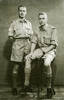 Studio photo of GE Metcalf (S/N 24644) standing and his younger brother LG Metclafe (s/n 237884).