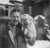 William "Bill" George Radford, Faenza, Italy circa 1944 with the Platoon mascot "Snowy".
