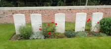 Photograph taken 12 September 2015 at Foncquevillers Military Cemetery (18 km south-west of Arras, France). 
Left to Right:
F.R. Stewart, d. 4 August 1918.
E.N Tarrant, d. 3 August 1918.
A.T. Johnstone, d. 3 August 1918.
E. Pirimi, d. 14 July 1918.
R. Cochrane, d. 3 August 1918. 

This photo supplied in commemoration of the death of my great uncle Eric Norman Tarrant, on 3 August 1918 in the battlefields of the Pas de Calais.
12 New Zealand soldiers are buried at the Foncquevillers Military Cemetery.  Eric and his four colleagues are buried together, while the other NZ'rs are among the 634 gravesites at this beautifully maintained cemetery.   
