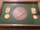 The big brown one is presented to the family of a serviceman  who  died in the line of service in WW1  along with a scroll ( don’t have this)
 
Medal on right side with the horse presented to every serviceman who was in WW1
 
Medal on left – Distinguished Conduct Medal- presented to serviceman for gallantry in the field