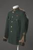 Manawatu Mounted Rifles dress uniform, circa 1890 - 1910, worn by Arthur Batchelar. Dark green wool uniform, made by HB [Hallenstein Brothers], with insignia for rank of 2nd Lieutenant, also a Boer War medal ribbon. Held by Te Manawa Museums Trust, Palmerston North