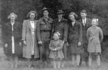 Fay, Pat, Bill, Charlotte, Dora (Cathy), Maurice, Betty, Margaret (front) absent John (Jack) McEwan