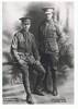 Two young soldiers, in uniform, before going overseas to Gallipoli. Seated is Joseph Clark. Standing Robert Clark