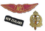 2NZEF woven and metal badges worn by Ray Squires as part of his uniform during service. The woven wings with an acronym may be AMCC the Air Mobility Command Centre or possibly MCAA which may stand for a local Marlborough organization Marlborough Aero Club Cadets. The auction lot also contained pieces cut from Nazi uniforms as trophies.
