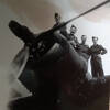 Photo of four men standing on the engine of an aeroplane from the collection of NA Cooper (s/n NZ415966).
