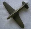 The is a model of a Spitfire?  It was made by Claude Harding (Junior).  Length 13cm x width 17cm and weighs 300gms.  I think it is made of brass.