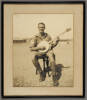 Unknown, photographer, [Jack Petrie with banjo]. ca. 1944. Auckland War Memorial Museum PH-2019-25-1
