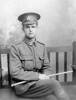 Portrait, William Bridge 1916, aged 19, seated holding staff, cap with Reinforcements badge, Rifle Brigade collar badges, shoulder badge (brass) on left epaulette ? 20th Reinforcement? (photograph provided by Sandra Baker 2008). - No known copyright restrictions