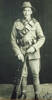 Portrait, WW1 soldier standing with rifle (kindly provided by C. Callow) - No known copyright restrictions