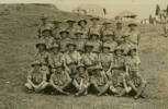 Group, WW2, No. 5 Platoon, Training - Samabula Camp, Fiji 28.1.41. Back Row: Cpl E. Percival, Ptes G.C. Brier, J. Borovich, M. Dent, R. Jones, T. Flinn, C. Wigmore, N.Lithgow. Third Row: N. Cullens, N. Manning, F.Jones, F. Lomas, C.Thatcher, T. Cuthbert. Second Row: Cpl Tappin, Sgt Moulden, Lieut. Osborne, Colonel Voelckner, Q.S.M. T. Waites, Ptes V. King, G. Skinner. Front Row: T. Sveistrup, A. Thompson, E. Ward, G. Measures, E. McEwan, H. Corcoran and puppy - This image may be subject to copyright