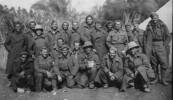 Group of POWs in Bardia Prison Camp taken in 1941, Sergeant Rikys is seated first on right, front row. His friend Gunner Simpson is 4th from left, back row. - This image may be subject to copyright