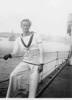 Portrait, Keating in uniform leaning on the railings on board a ship. - This image may be subject to copyright