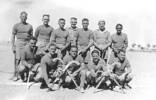 Group, hockey team WW2: Mr Sutton in a hockey team in Syria in 1942 and he is second from right, front row. The original of the photograph is Mr J A Strong of Auckland who was in the same battalion. - This image may be subject to copyright