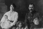 Soldier and family, post WW1 Percy Bussey in uniform, wearing a RSA badge with his wife, three children. The child on Mrs Bussey's knee is Rose E. Bussey. - No known copyright restrictions