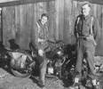 Jack Bentley is on the motorbike. The man standing in uniform is a friend, name unknown. - This image may be subject to copyright