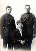 Family, 2 soldiers, brothers, in uniform and their mother - (Left to Right) Melville James Bull, Etty (Esther) Bull (mother), and Lindsay Kingscote Grenville Bull. - No known copyright restrictions
