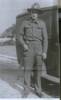 Portrait, standing in uniform beside a car - This image may be subject to copyright