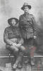 Brothers Private Richard (Dick) Alexander Henderson (3/258) (right) and his elder brother, Rifleman William John Henderson, (15369), NZ Rifle Brigade (seated). Almost definitely taken in France. Image provided by Nigel Robson. - No known copyright restrictions