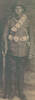 Portrait, WW1, standing, bandolier, rifle, Thomas Marsden Harwood, c1915 may be taken at Putorino, Hawera - No known copyright restrictions
