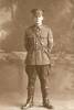 Portrait, WW1, Leslie Buchanan photographed at Schmidt Studios in his Quartermaster Sergeant's uniform in the 3rd. Auckland Mounted Rifles July 8, 1915 - No known copyright restrictions