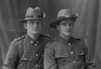 Group, 2 soldiers, seated wearing hats, 8/2624 Robert Hyndman (left) and unnamed soldier - No known copyright restrictions