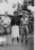 Photograph taken in Suva on 29 March 1942. Sergeant Joe Butler (69433) standing on the left with his hands in front, in the middle is a Fijian Policeman, and on the right is Sergeant Bill Arnold (69431). - This image may be subject to copyright
